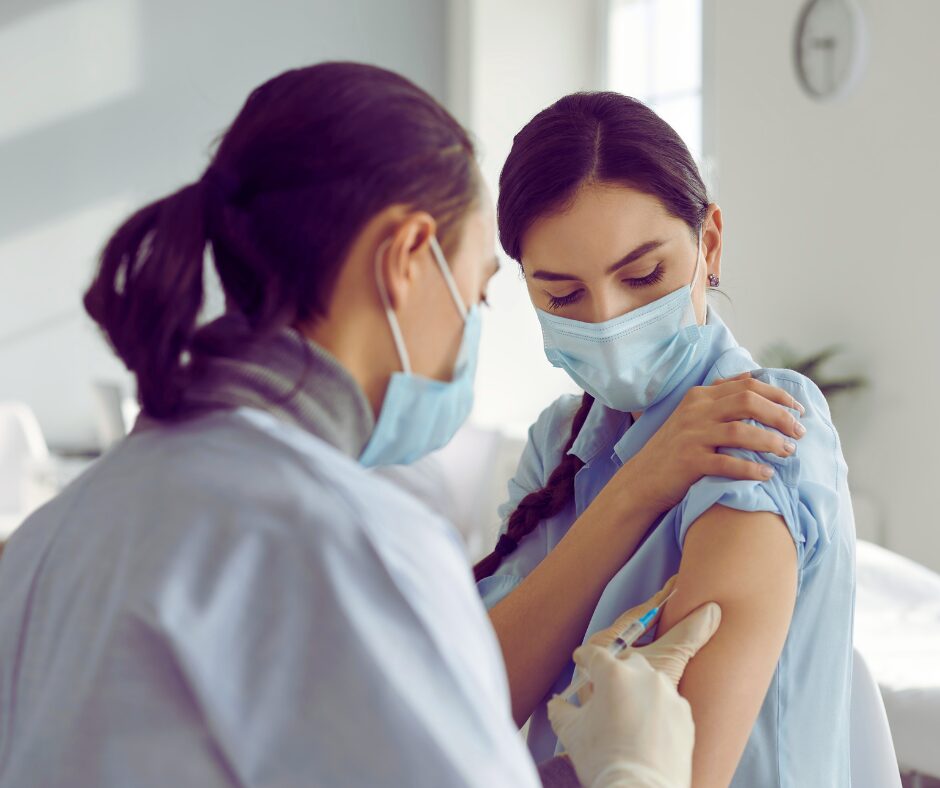 healthcare professional administering a flu shot